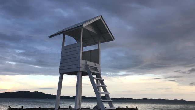 lifeguard tower on the beach. Wooden white pavilion at shore. Wood white pavilion at shore.