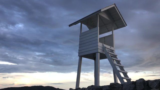 Wooden white pavilion at shore. Wood white pavilion at shore.