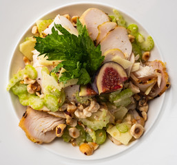 Grilled chicken breast salad with figs, green apple, celery, nuts and Parmesan.