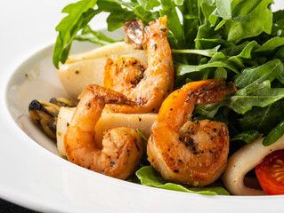 Fresh Sicilian Salad with shrimps, arugula, cheese and ripe orange slices.