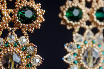 handmade jewelry made of beads in macro. earrings from white beads. earrings from stones