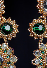 handmade jewelry made of beads in macro. earrings from white beads. earrings from stones
