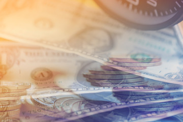 Double exposure Rows of coins of Clock,cash,money, dallar on the table,finance and business concept,Tex time soft focus and blurred style,dark tone.