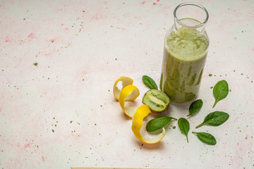 fruit green smoothie with spinach, kiwi and lemon, copy space