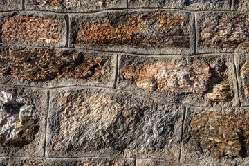 Close-up details of natural rock wall in mountain refuge