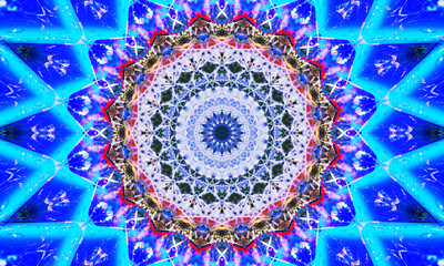 Kaleidoscopic mandala Art with a lot of small shapes and blue patterns.
