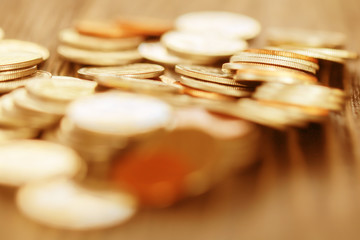 Row of coins on wood background for finance and Saving concept,Investment, Economy, Soft focus and dark style.