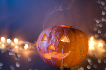 Jack O Lantern Halloween pumpkins, burning candles. Symbol of halloween