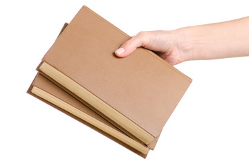 Stack of books in hand on a white background isolation