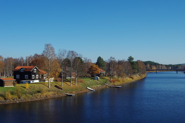 Fototapeta na wymiar A sunny autumn day in the small rural town of Björbo in Dalarna.