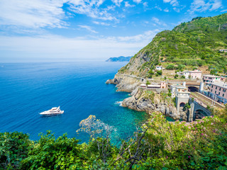 Fototapeta na wymiar Riomaggiore, an ancient village in Cinque Terre, Italy in the province of La Spezia, situated in a small valley in the Liguria region of Italy