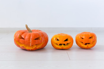 Halloween pumpkins. Funny Jack O'Lantern on the light room