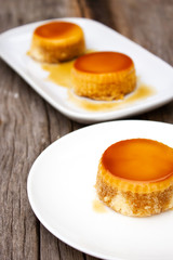 Homemade custard cake on white plate. Sweet dessert.