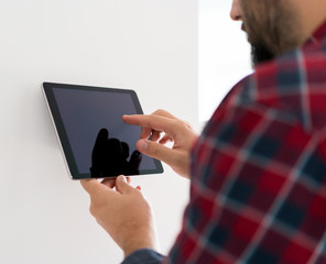 Man using smart home device