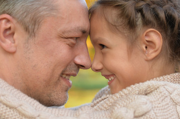 Portrait of a father and daughter having fun outdoors