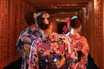 Girls walkin Fushimi Inari Shrine on Geisha attire
