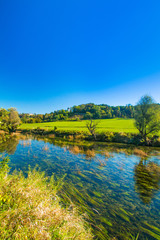 Obraz na płótnie Canvas Croatian rivers, valley of Dobra and old fortress in Novigrad, green countryside landscape Karlovac county 