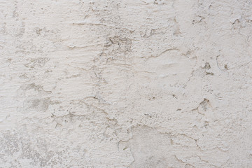 Fototapeta premium Wall fragment with scratches and cracks. It can be used as a background