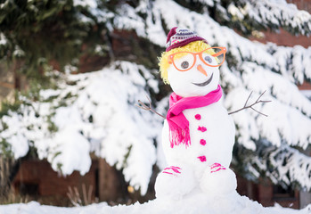 Snowman on snow background