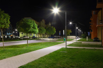 apartment quarter at night with modern LED street lights