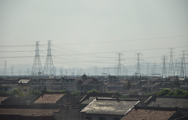 Chinese homes in front of power poles