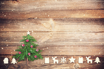 christmas tree on wooden board with  wooden decorations