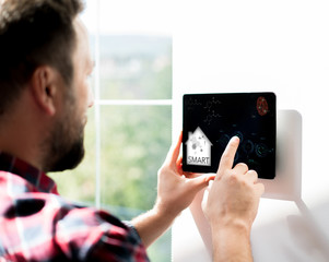 Man using smart home device