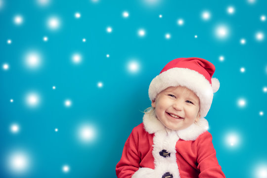 Portrait of child wearing Santa Claus costume