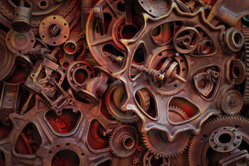 Steampunk background, machine parts, large gears and chains from machines and tractors.