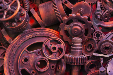 Steampunk background, machine parts, large gears and chains from machines and tractors.