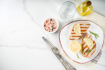Grilled tuna fish steaks with lemon and spices