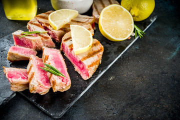 Grilled tuna fish steaks with lemon and spices