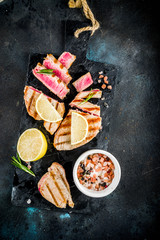 Grilled tuna fish steaks with lemon and spices