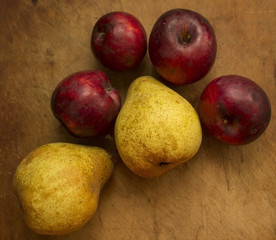 apples in a bowl on wooden table