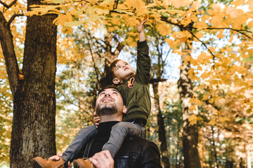 father and son in autumn park