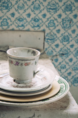 Abandoned house with teacup