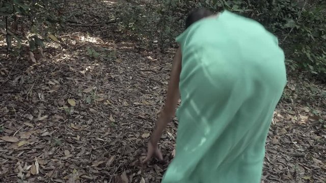 terrified and scared woman escapes desperately from her pursuer in the forest