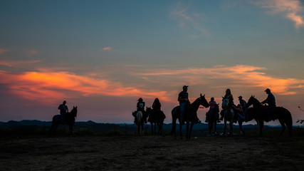 Horse Riders at Sunset