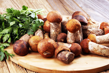 raw mushrooms on wooden table. organic fresh mushrooms