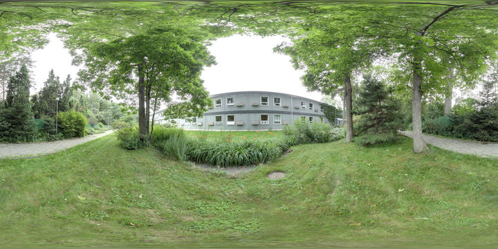 360 degree spherical panorama of green garden with two-storied wooden house