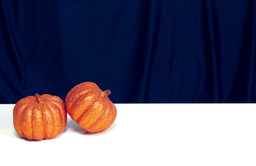 Isolated Halloween orange pumpkins. Black background. Copy space for text.