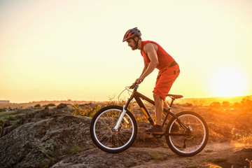 Fototapeta na wymiar Extreme cycling, mountain biking on the rocks, free space.