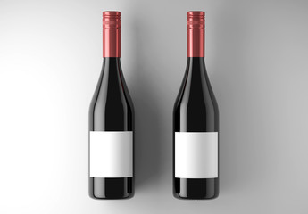 2 Black Wine Bottles Mock-Up on a white studio. 3d rendering. - 227997448