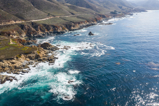 Aerial View of Ocean and California Coastline on Sunny Day