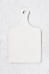 White textured background with cutting board