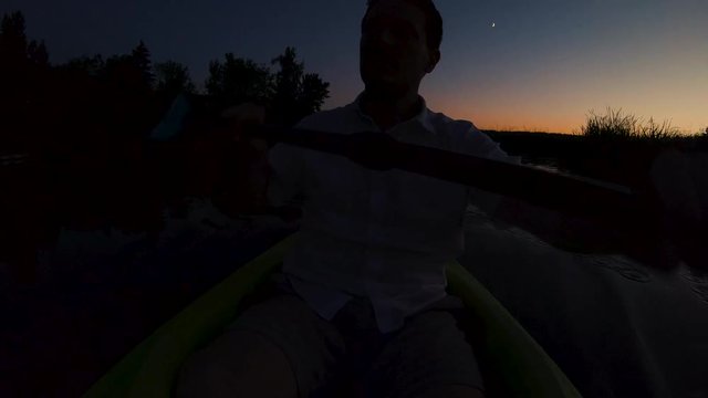 Kayaking Sunset Silhouette of Man Paddling Under Moon