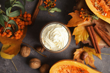 Flat lay composition with tasty pumpkin spice latte on table