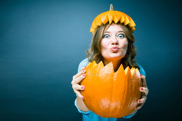 Portrait of beautiful cheerful woman with pumpkin Thanksgiving day 