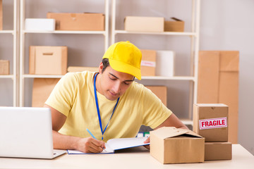 Handsome contractor working in box delivery relocation service 