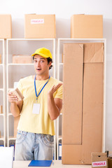 Handsome contractor working in box delivery relocation service 